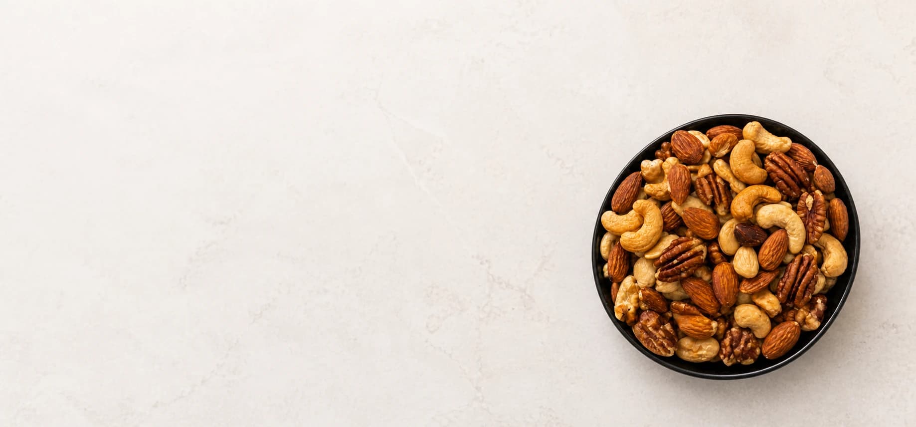 Tray of mixed, freshly roasted nuts from De Notenman