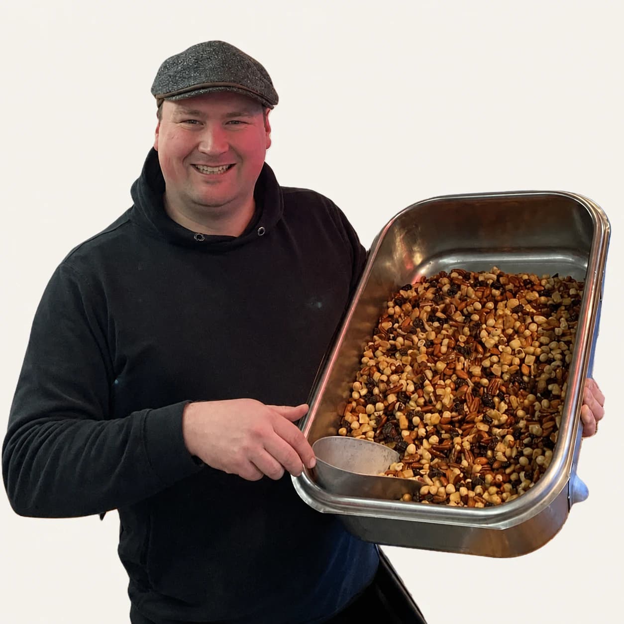 De Notenman holding a tray full of mixed nuts